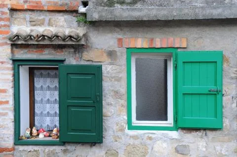 Two windows with green shutters Stock Photos