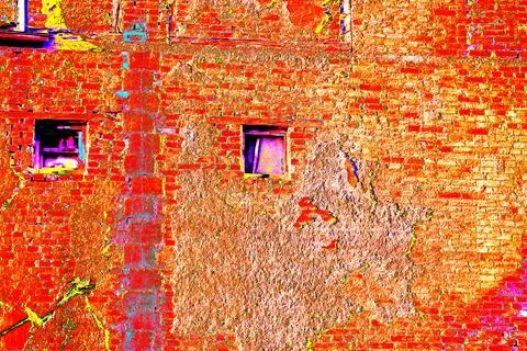 Two windows in the old brick walls, old masonry. brick background. Stockfoto's