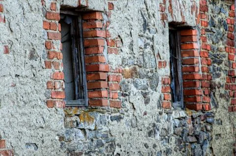 Two windows in the old stone brick wall. Stock-Fotos