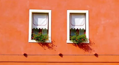 Two windows with orange wall Stock Photos