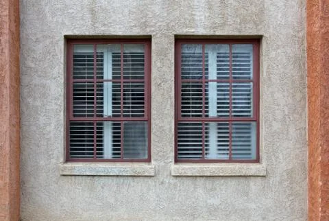 Two windows stucco wall Stock Photos