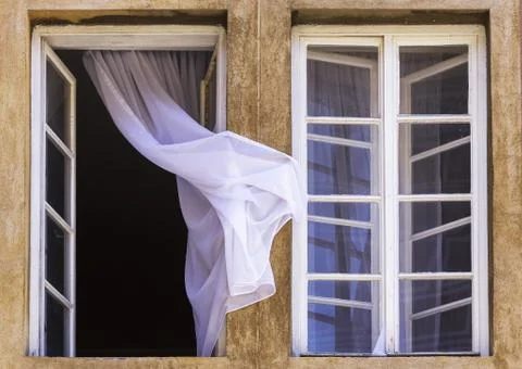 Two windows viewed from outside with curtain Foto stock