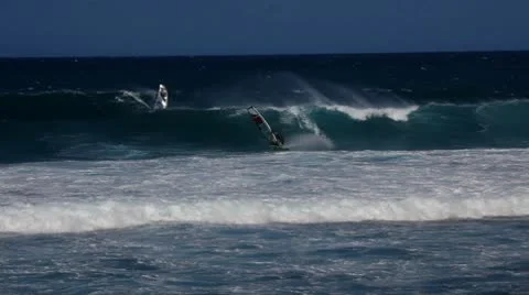 Two Windsurfers Waveriding Stock Footage