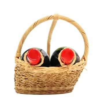 Two wine bottles on present basket isolated on white Stock Photos