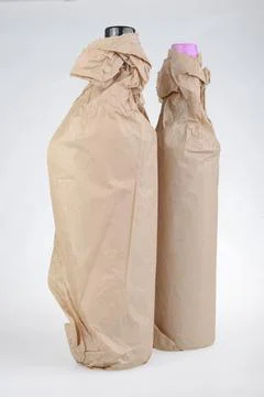 Two wine bottles in wrap Stock Photos