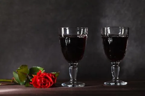 Two wine glass on dark table Stock Photos