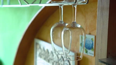 Two wine glasses hanging in the kitchen Stock Footage 131431585