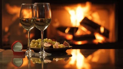 Two wine wineglasses with the red box with engagement ring . Stock Footage 80313190