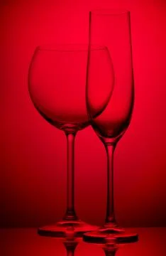 Two wineglasses on red Stock Photos