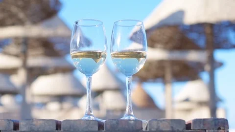 Two wineglasses of white wine . Stock Footage 83211049