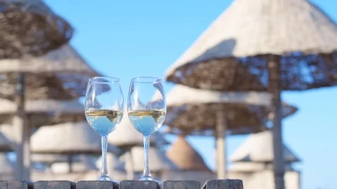 Two wineglasses of white wine . Stock Footage 83211121