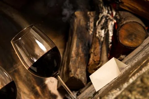 Two wines by fireplace with message 写真素材
