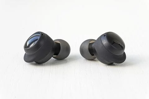 Two wireless headset closeup. Wireless headphones on a white background. Foto stock