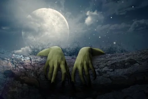 Two witch hands reaching out from a wooden log with full moon background. S.. Stock Photos