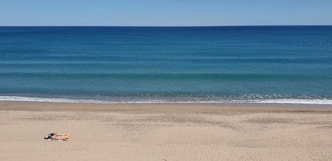Two woman on a empty beach, Miami Platja, Costa Dorada, Tarragona, Spain Stock Footage 130060148