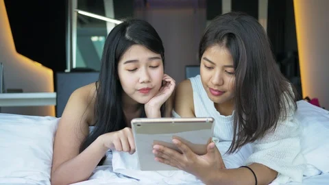 Two woman watching tablet Stock Footage