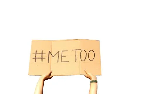 Two woman's hands holding a cardboard sign that says me too No sexism concepto Stock Photos