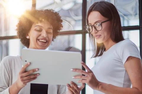 Two women analyzing documents office. Woman executives at work in office Stock Photos