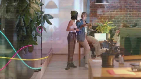 Two women angling tablet and sharing content, sparking animated data lines Stock Footage 333899100
