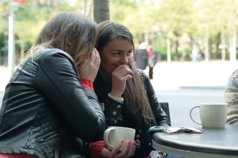 Two women backbite a man in the restaurant, outside Stock Footage 36657539