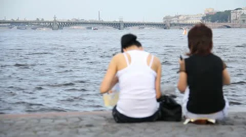 Two women on the background of the river Stock Footage 10833504