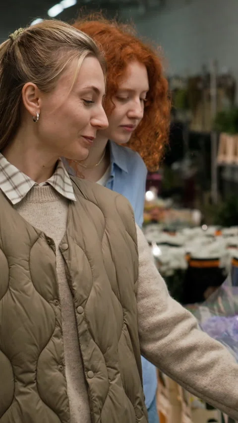 Two Women Choosing Fresh Hydrangeas in Wholesale Flower Warehouse Stock Footage 343626802