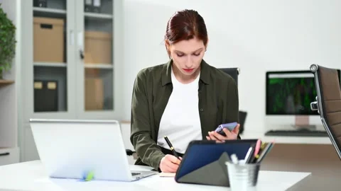 Two women coding together in a high-tech office, showcasing teamwork, softw.. Video stock 312387402