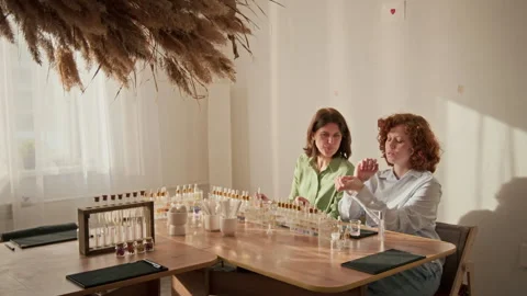 Two Women Creating Custom Scents at Perfume Master Class Stock Footage 337115095
