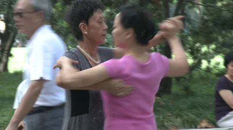 Two women dancing in park Stock Footage 37704449