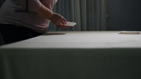 Two women of different generations setting a dining table together Stock Footage 340061810