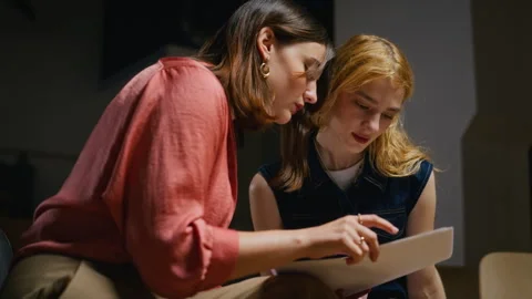 Two Women Discussing Script in Student Theater Rehearsal Stock-Footage 344521747