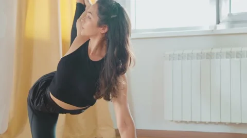 Two women doing exercises on a mat in a yoga studio. Sport and Healthy lifestyle Stockbeeldmateriaal 230442656