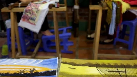 Two women doing the needle work in a vietnamese factory. 库存影片 74327962