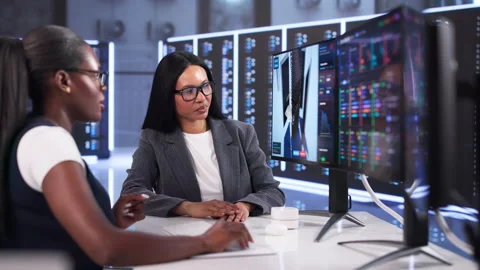 Two Women Engineers Discuss Data Center Infrastructure Plans Stock Footage 333401392