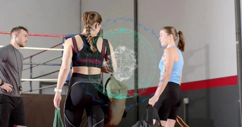 Two women holding ropes, preparing ring work, digital circle over faces, coach Stock Footage 321860465