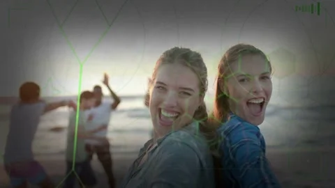 Two women laughing turning while camera nearing beach, reaching lens, overlay Stock Footage 333018588