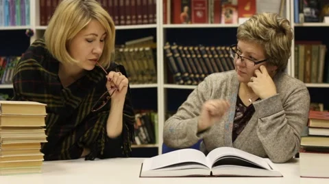 Two women at a library Video stock 46064783