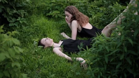 Two women lying on the grass 库存影片 140804086