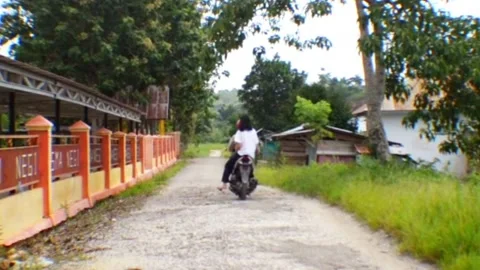 Two women on motorbikes Stock Footage 144238532