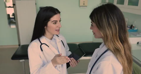 Two women physicians shaking hands finish meeting in hospital office Stock Footage 270366453