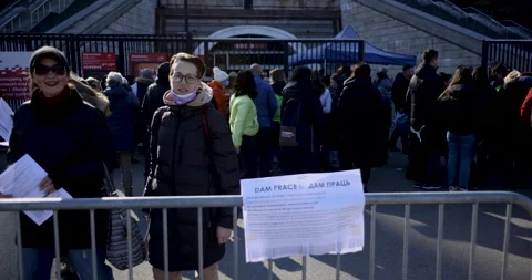 Two women pose to the camera at the registration center on the National Stock Footage 199236988