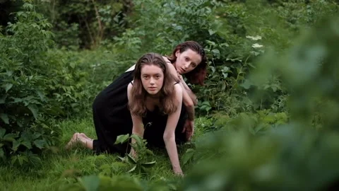 Two women posing on the grass Stock Footage 140804089