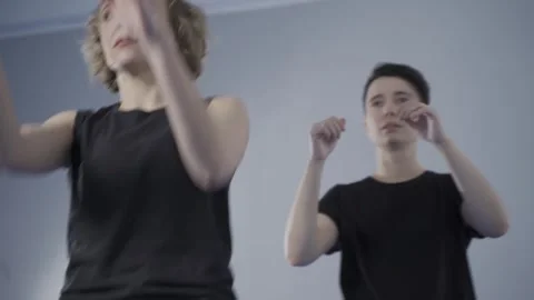 Two women practicing martial arts and taekwondo in a gym. Female self defense Vídeo Stock 335779972