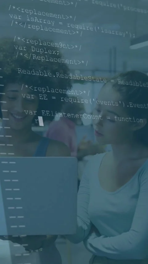 Two women reviewing code on laptop in tech lab, presenter opening project and Stock Footage 331199116