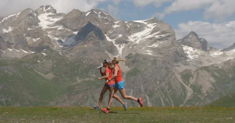 Two Women Running in Slow Motion at High Altitude Stock Footage