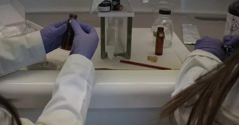 Two women scientists analyzing samples in a laboratory Stock Footage 125046581
