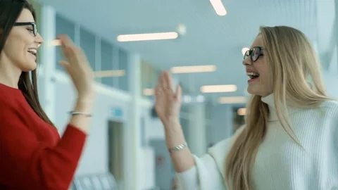 Two women shaking hands. Friendly greeting. Slow motion. Stock Footage 71819211
