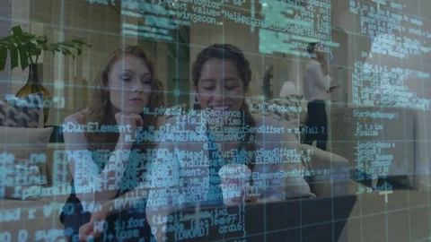 Two women software team activating laptop and navigating code overlay spotting Stock Footage 319871849
