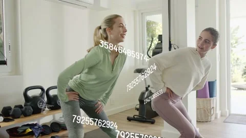 Two women starting with lateral step in fitness gym, data stream crossing torsos Stock Footage 333078323