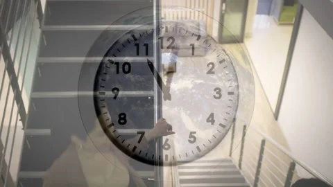 Two women stepping down office stairs, clock overlay shifting, holding railing Stock Footage 335762250